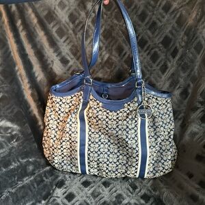 Coach hand bag with matching wristlet.